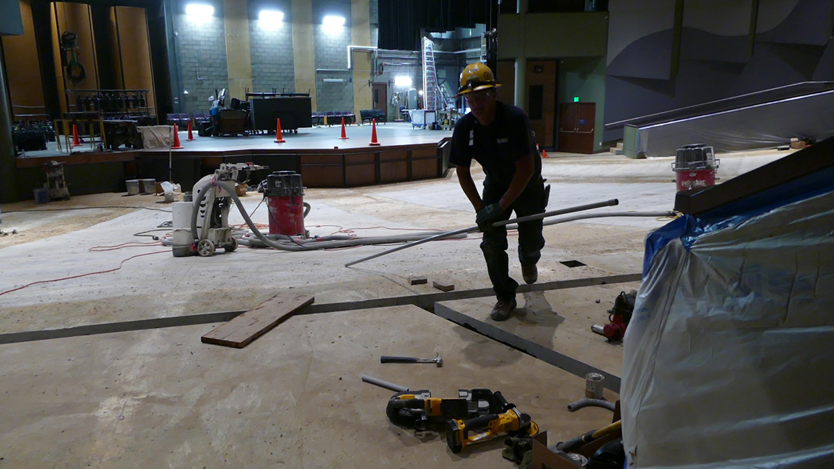 Construction crews at work in The Lincoln Center Performance hall. There are no seats.