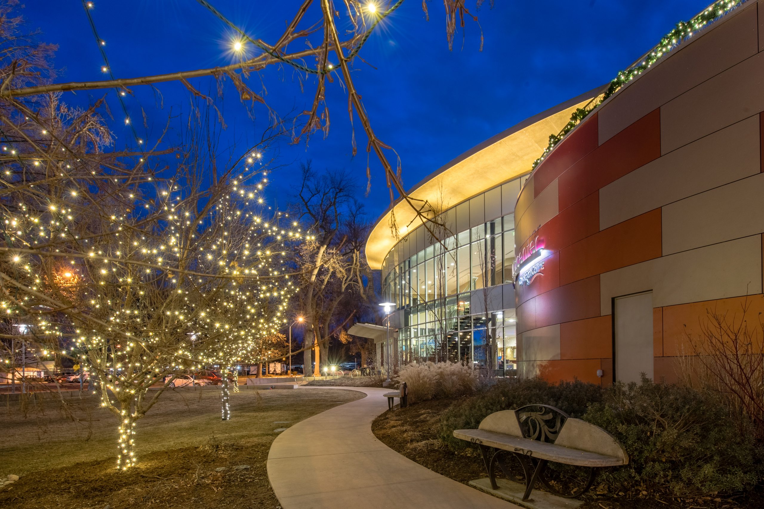 An exterior shot of The Lincoln Center with the trees lit up for the holidays.
