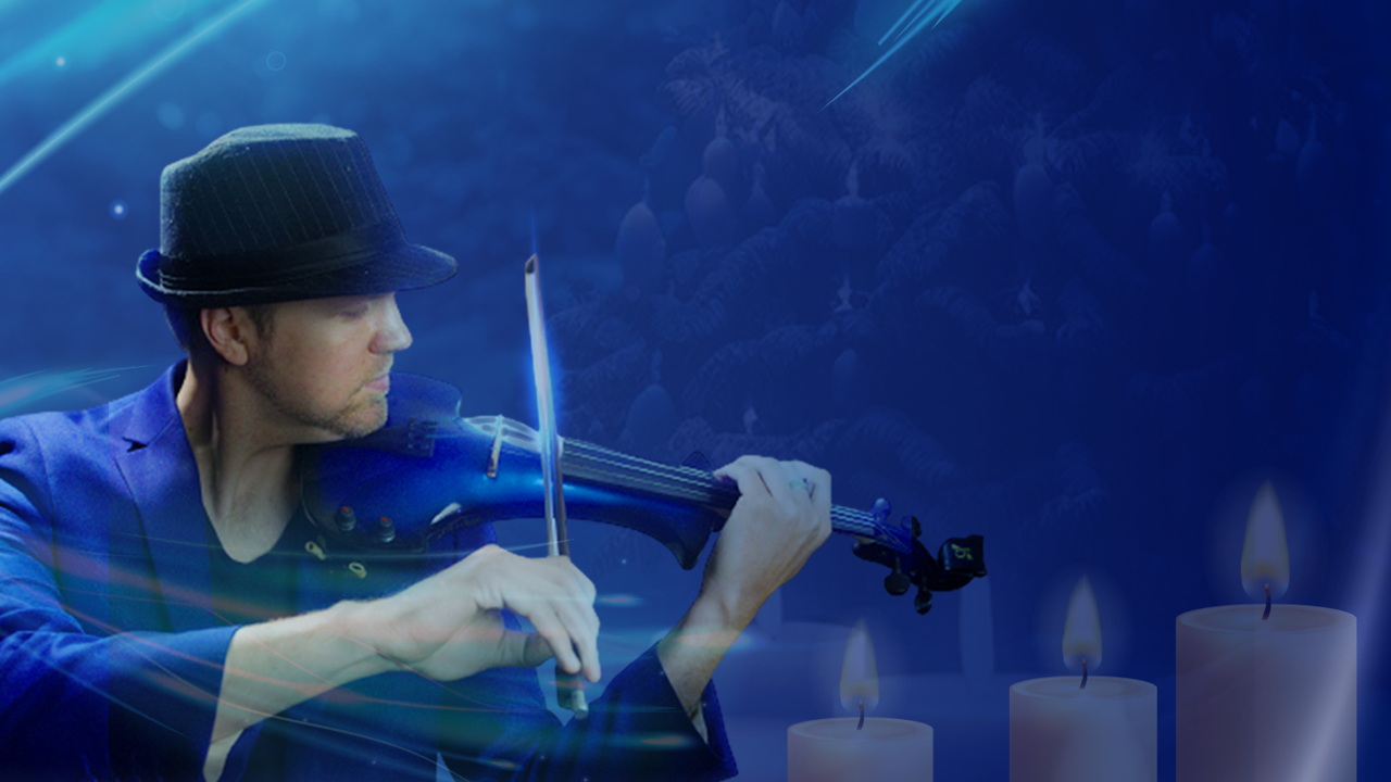 A gentleman with a hat plays violin next to 3 candles