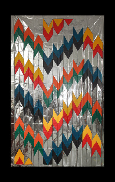 Mexican style design painted on a silver Mylar space blanket.