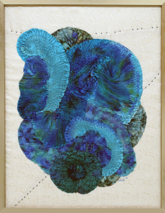 Quilt is made of pleated material.