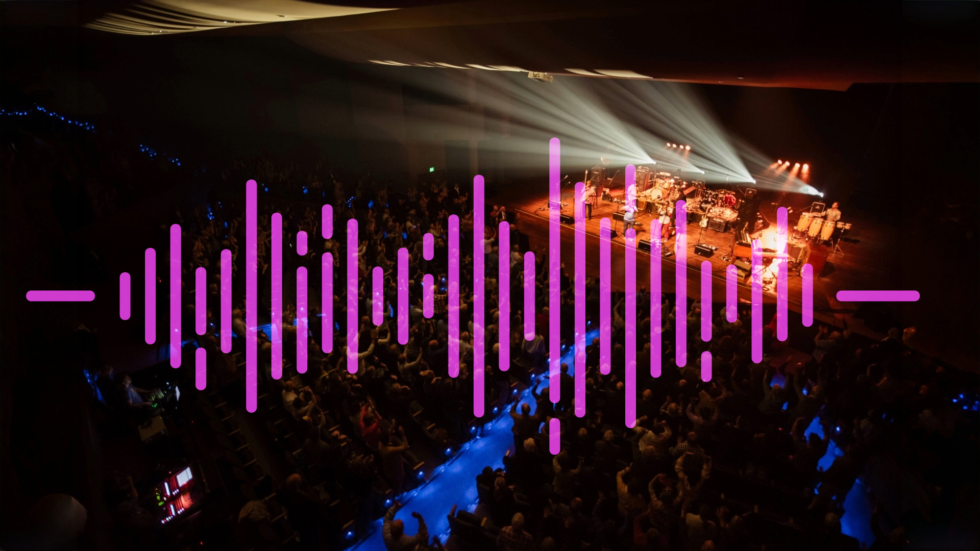 Image of an audience at The Lincoln Center with a pink soundwave over it